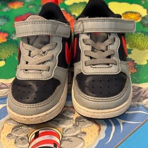 Nike Kids Black and Gray Sneakers with Red Swoosh